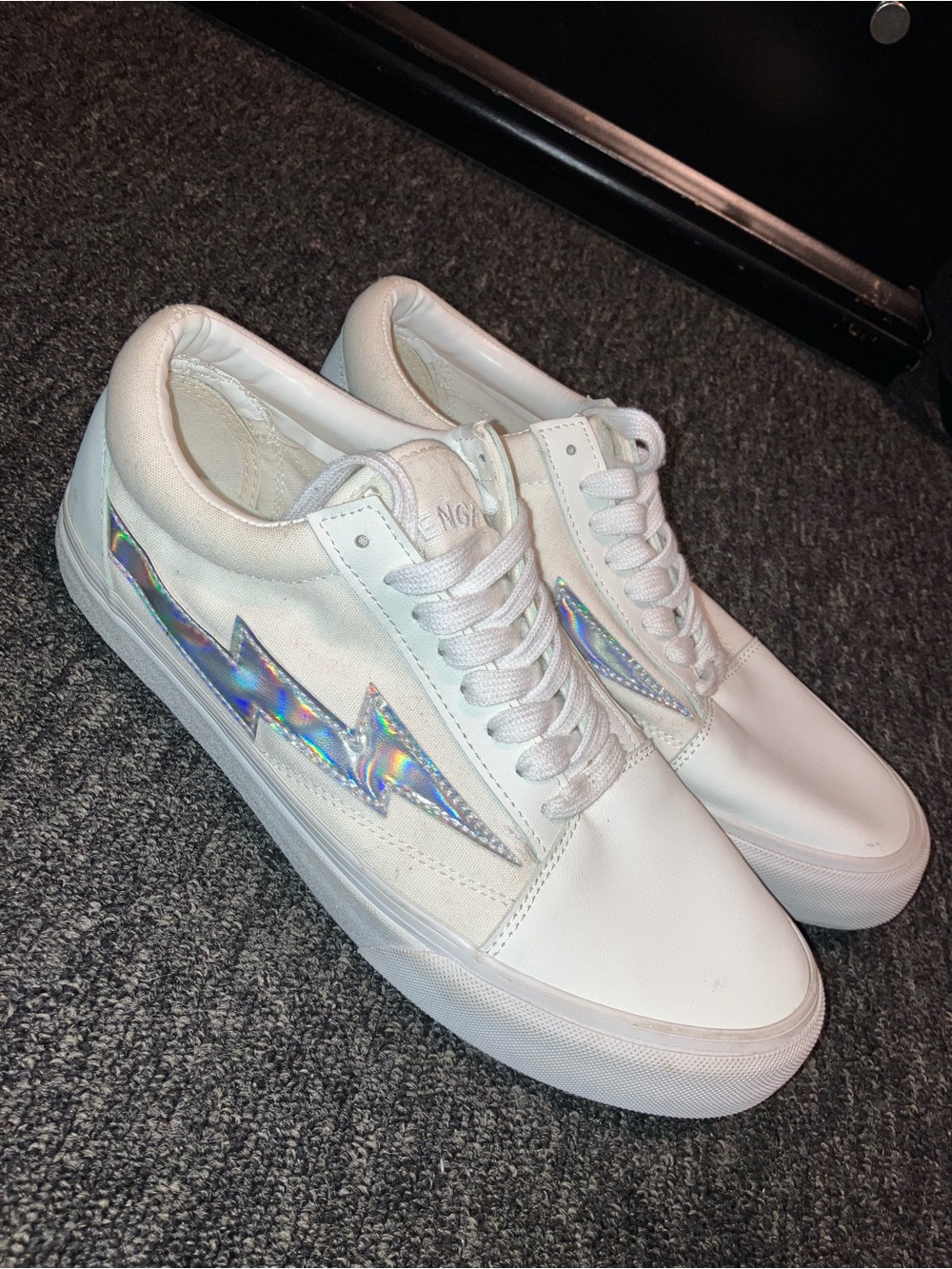 White Low-Top RevengexStorm Sneakers with Holographic Lightning Accent
